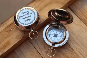 silver push button compass